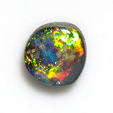 Green multi-coloured solid black boulder opal