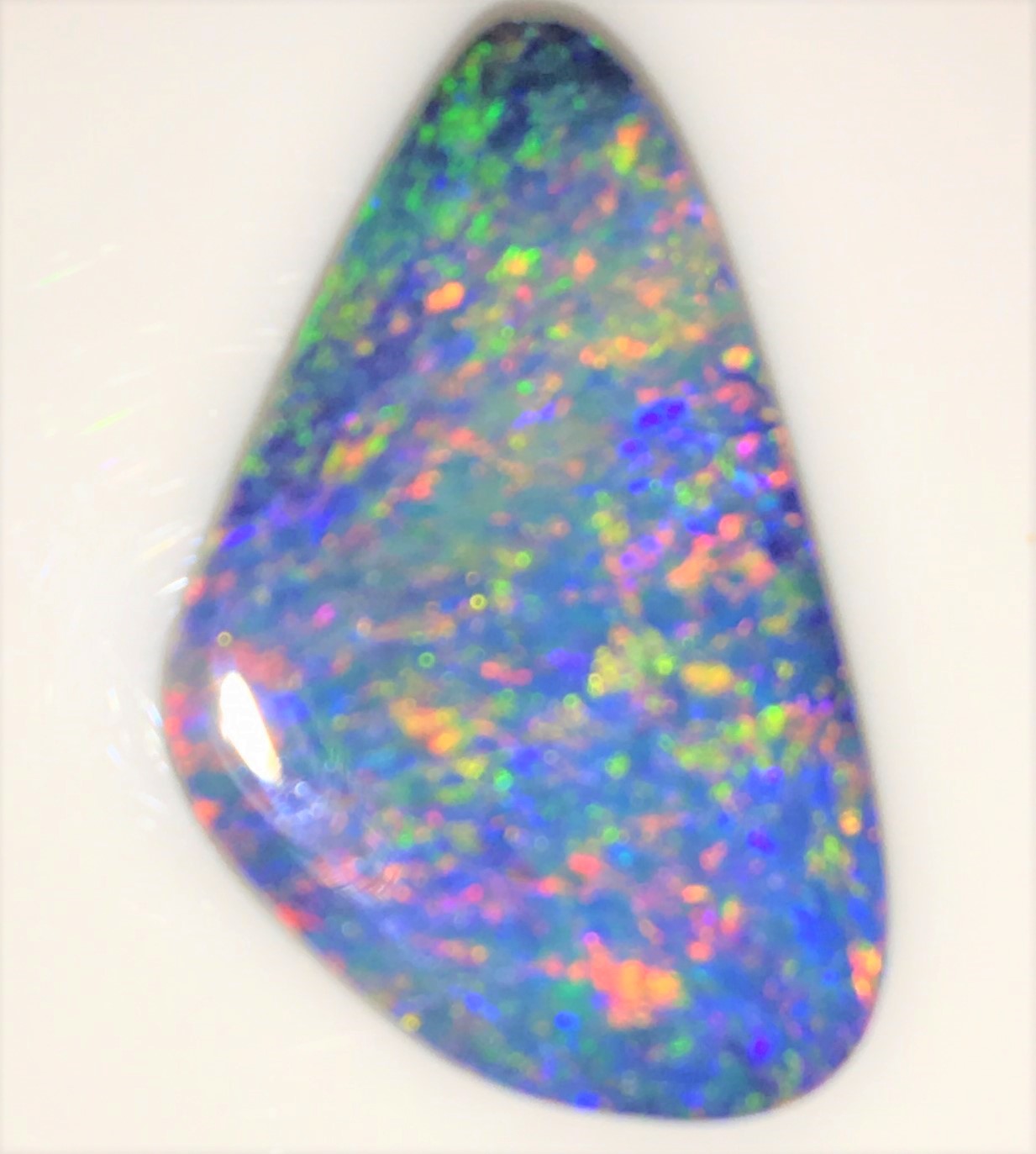 Blue, Gold, Orange, Pink and Green Doublet. Magic stone