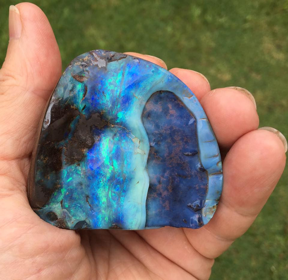 Green and violet boulder opal polished specimen
