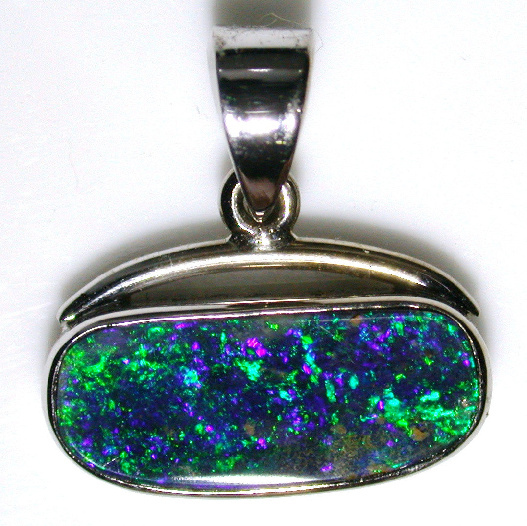 Emerald green solid boulder opal in 18K white gold pendant.