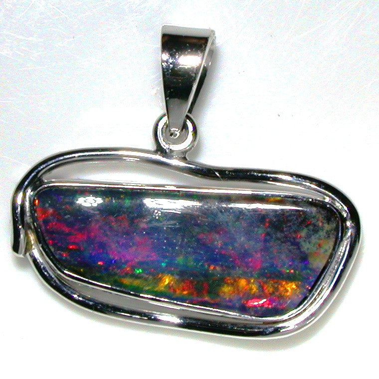 Very bright burnt orange and lime green solid boulder opal pendant in 18K white gold.