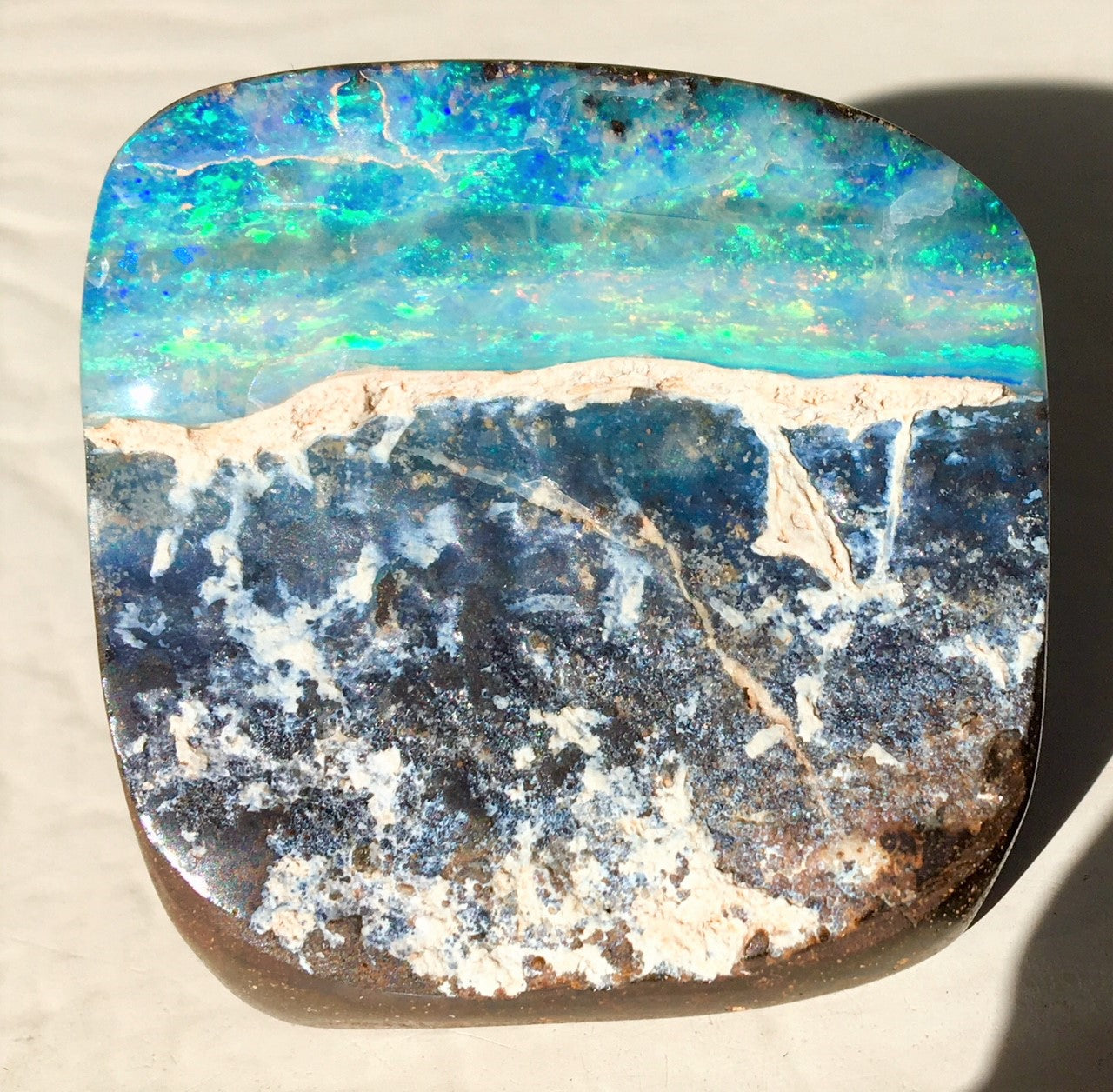 Multi Coloured boulder opal polished speciman