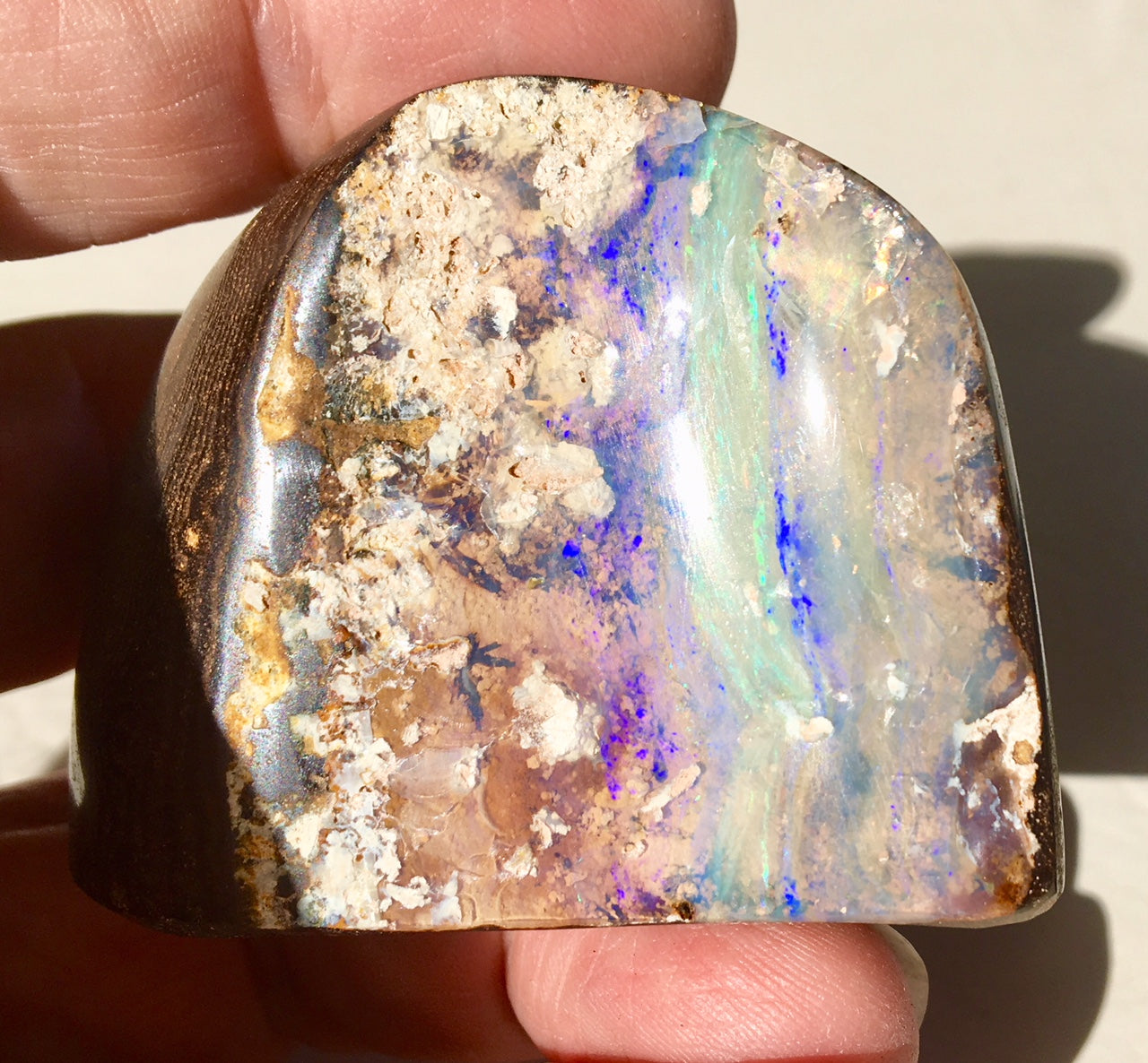 Violet Green boulder opal polished speciman