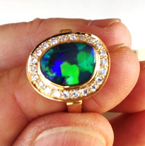 Green, Blue and Orange solid black boulder opal from Quilpie , 18k Ring