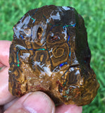 Rough boulder opal with green bars